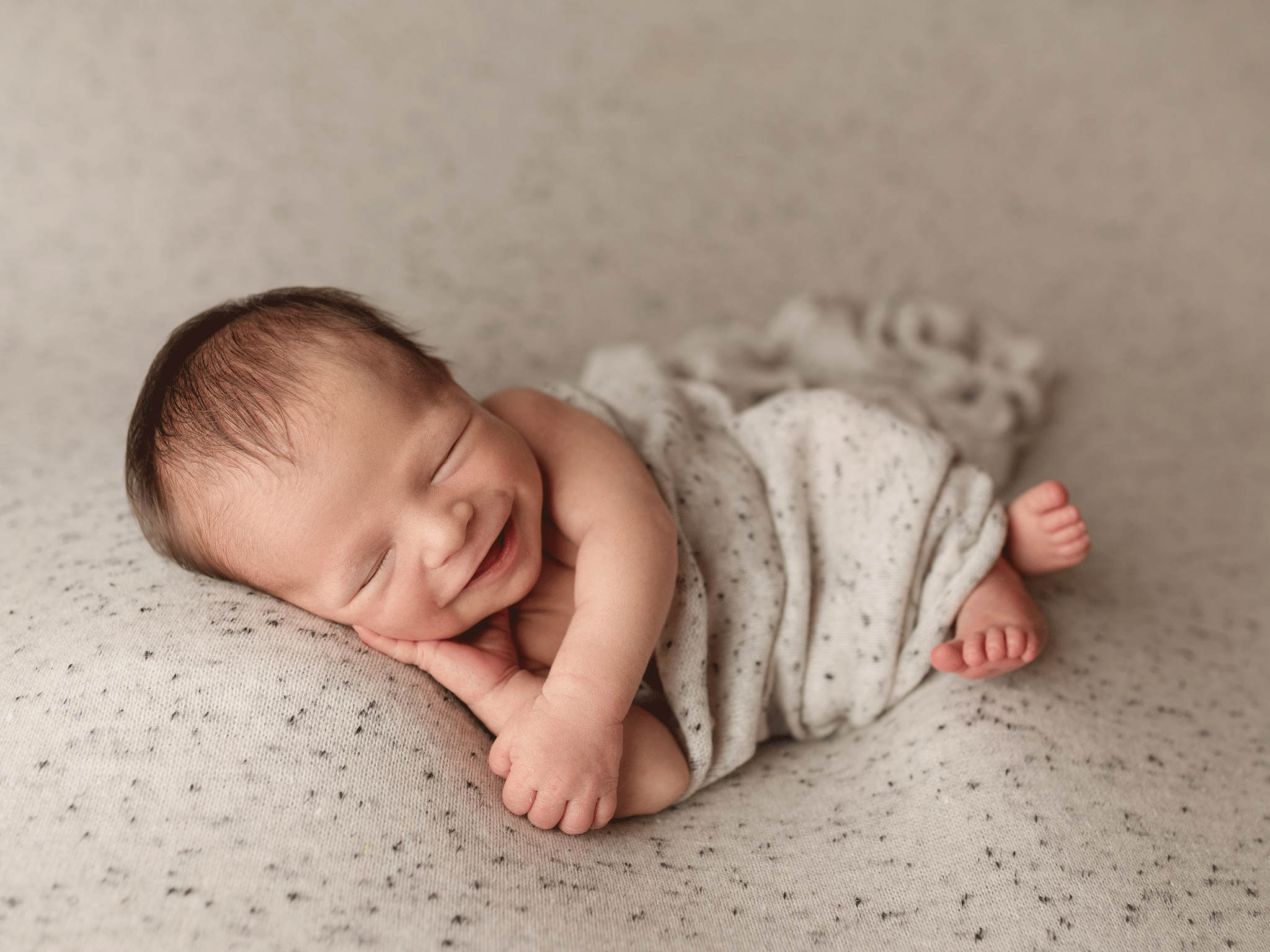 newborn boy smiling brown