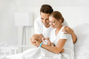 young parents with newborn