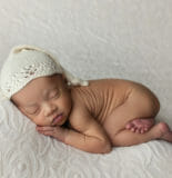 sleepy newborn baby girl session tushie pose