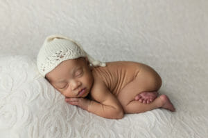 sleepy newborn baby girl session tushie pose in Lafayette