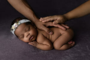 parent hands on baby photo session in Baton Rouge