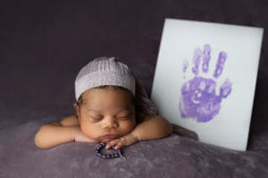 newborn baby girl memory handprint and bracelet
