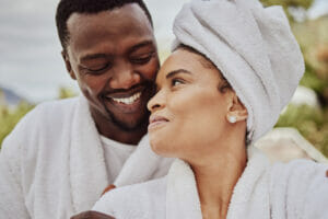 Spa, wellness and relax with a black couple in a health center or luxury resort for romance and dating. Vitality, rest and relaxation with a man and woman at a resort for a romantic weekend getaway.