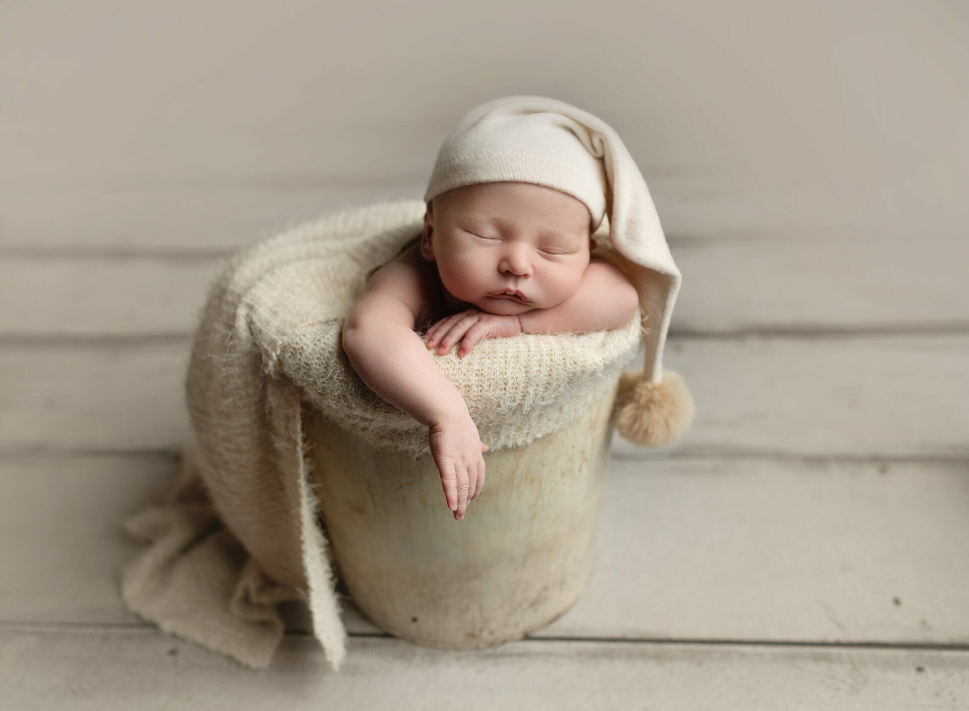newborn baby boy bucket pose sleepy in Lafayette