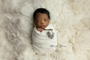 newborn baby boy swaddled with fishing pose in Baton Rouge