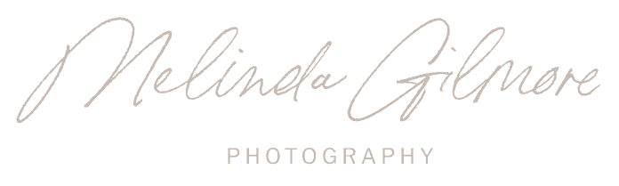The text "Melinda Gilmore" is written in elegant cursive script above the word "PHOTOGRAPHY" in uppercase letters. Melinda Gilmore Photography - Maternity & Newborn Photographer - Louisiana