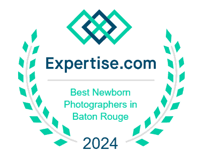 A badge with laurel leaves, geometric shapes, and the text: "Expertise.com Best Newborn Photographers in Baton Rouge 2024. Melinda Gilmore Photography - Maternity & Newborn Photographer - Louisiana